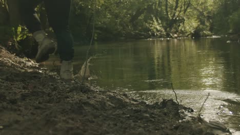 slow motion of a boot stepping on mud