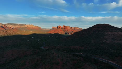 country road in dense forest near sedona town in arizona, united states