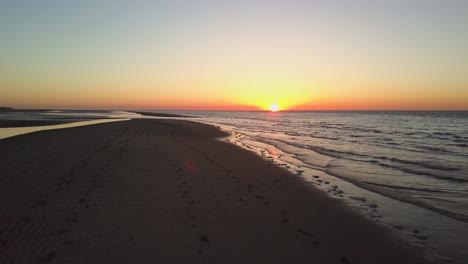 sunset at the dutch beach breezand in zeeland