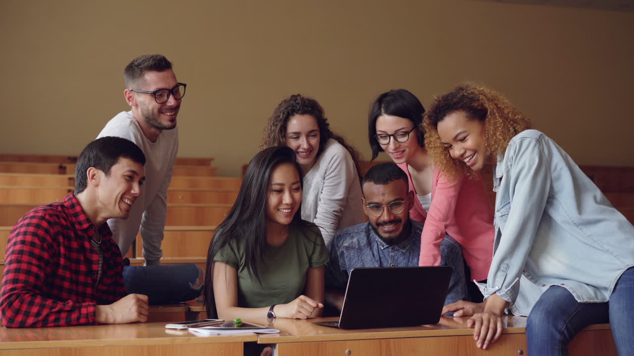 Students Collaborating on a Laptop in a Classroom
