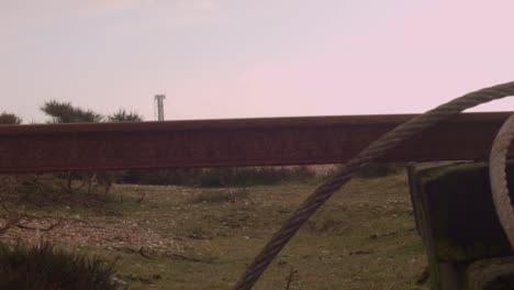 Slider-shot-of-industrial-fishing-rail-with-ropes-and-cables