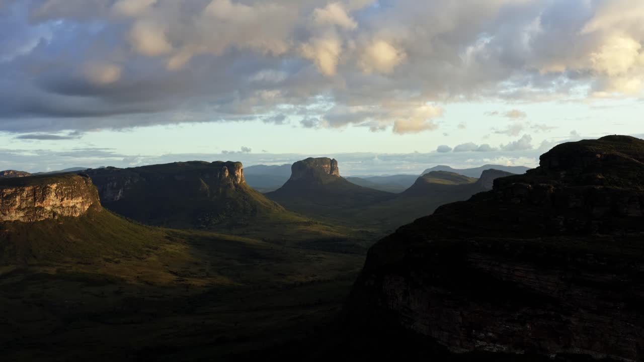 Timelapse of a beautiful drone landscape shot of the stunning Capao Valley from the Mount of Pai Inácio in the Chapada Diamantina national park in northern Brazil on a warm sunny summer evening