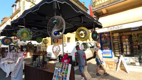 colorful wind spinners displayed at a street market