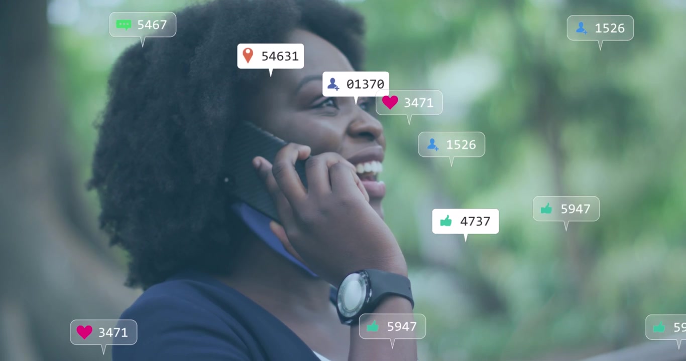 Animation of multiple social media icons over african american woman talking on smartphone outdoors