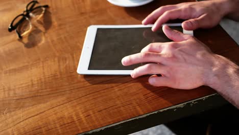 man using digital tablet