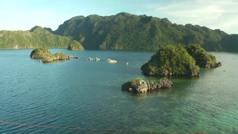 aerial view of siete pecados coral reef islands and mountains near coron, palawan