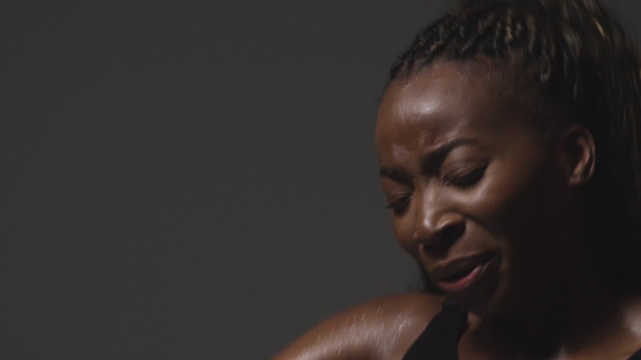 Studio Shot Of Woman Wearing Gym Fitness Clothing Exercising Recovering After Exercise 1