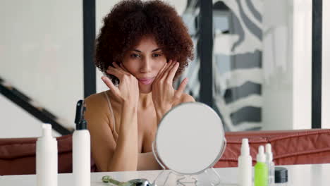 woman looking in the mirror