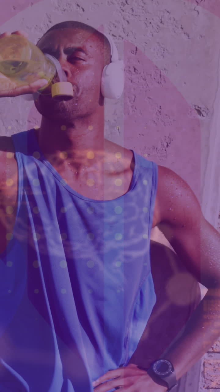 procesamiento de datos médicos contra afroamericano hombre en forma con auriculares bebiendo agua