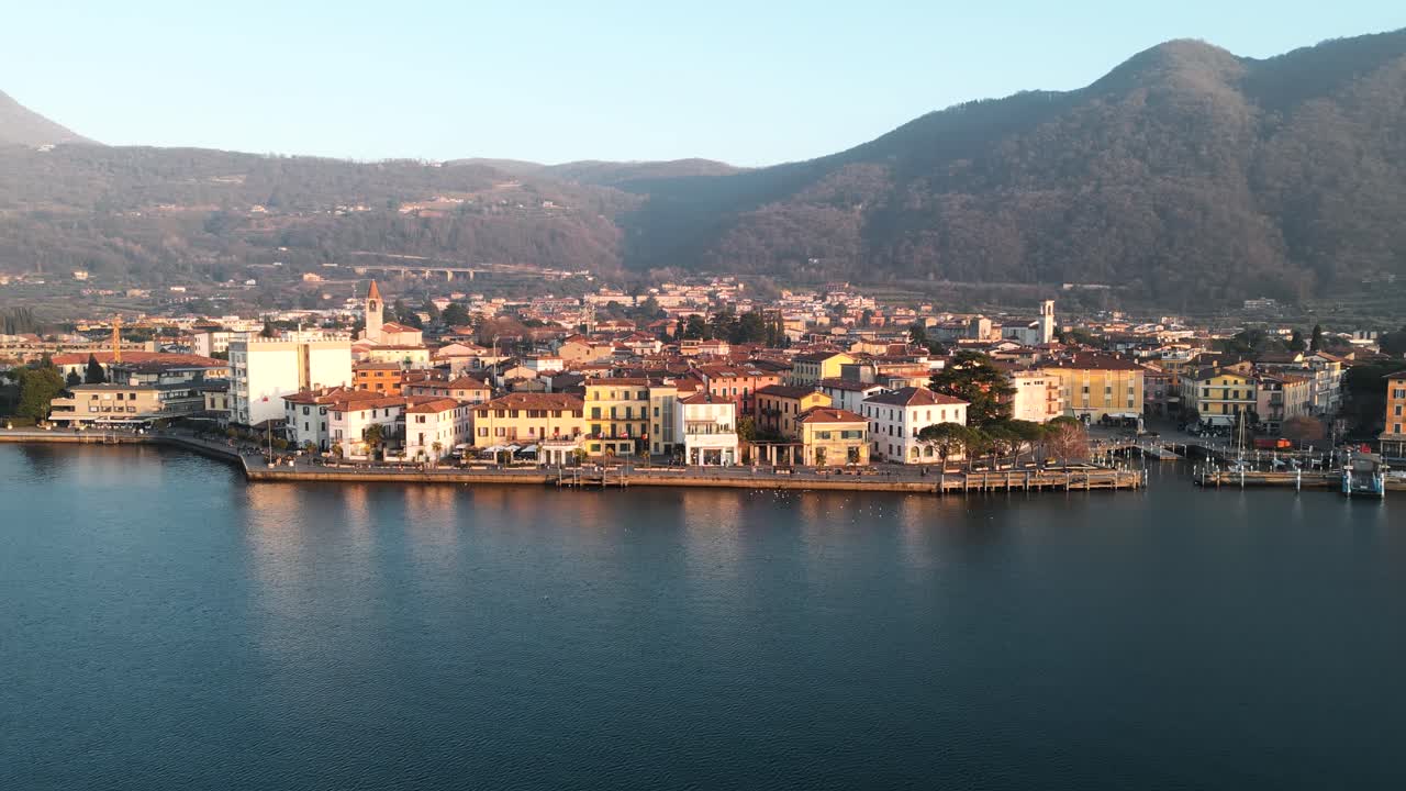 Aerial view city Iseo in Italy during sunset. Small town on Lake Iseo, tourist destination in Italian north in the mountains Alps between Lake Garda and Lake Como.