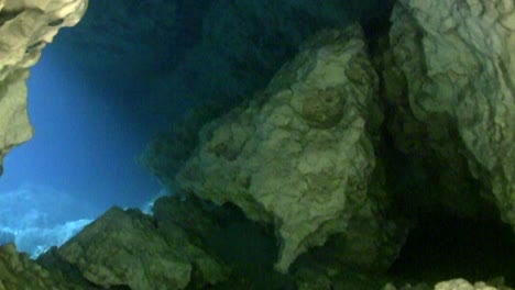 underwater pov of cave diving