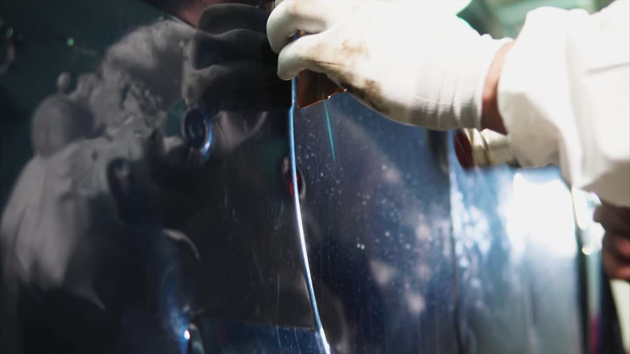 Applying protective film to car door