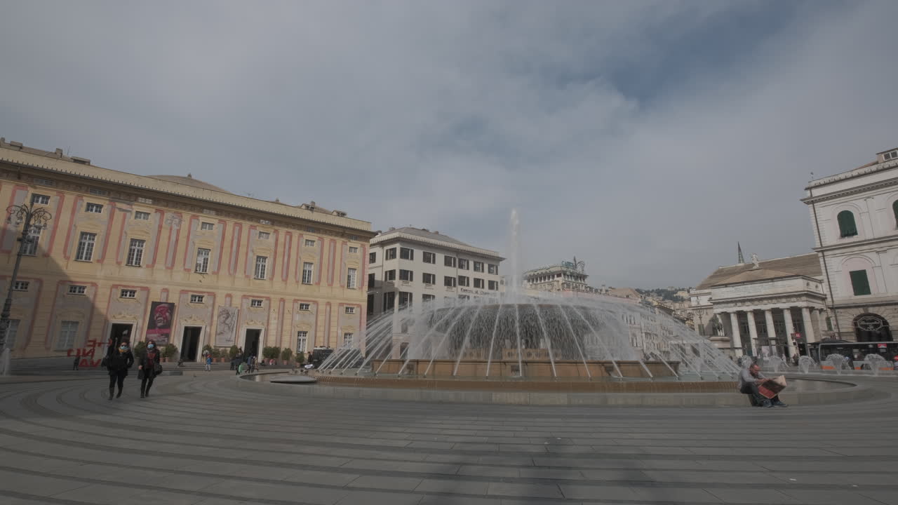 Genova Piazza De Ferrari square at sunny day. Ducale palace and Carlo Felice Theater