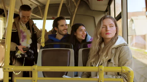 Young-woman-reading-in-the-bus