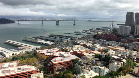 aerial view oakland bay bridge and embarcadero on a cloudy day