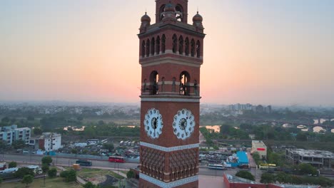 stunning aerial shot of lucknow’s clock tower, with the soft morning light illuminating its detailed structure.