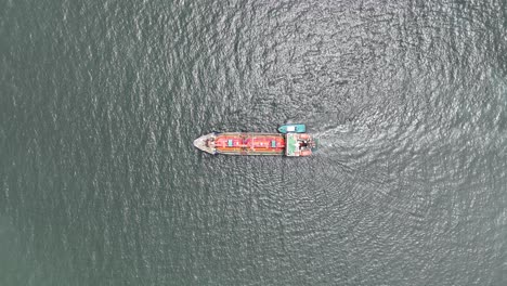 an aerial drone video of tanker ship in the port of thailand. aerial top down, industrial transportation of liquid chemical products.