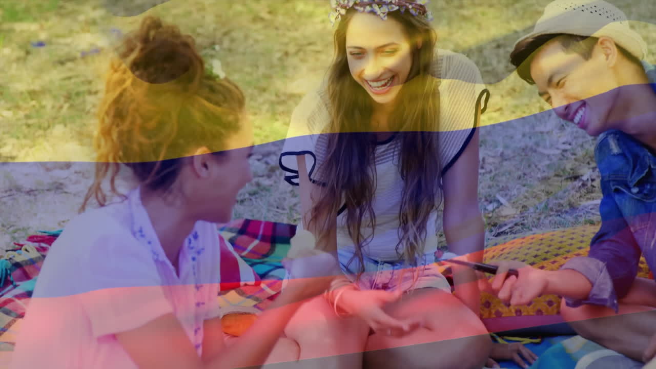 Laughing friends sitting on picnic blanket, enjoying colorful animation outdoors