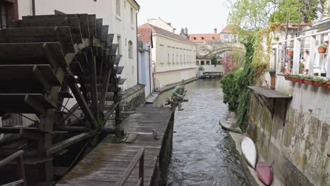 closeup of altes wasserrad - water mill on certovka devil's canal in prague, czech republic