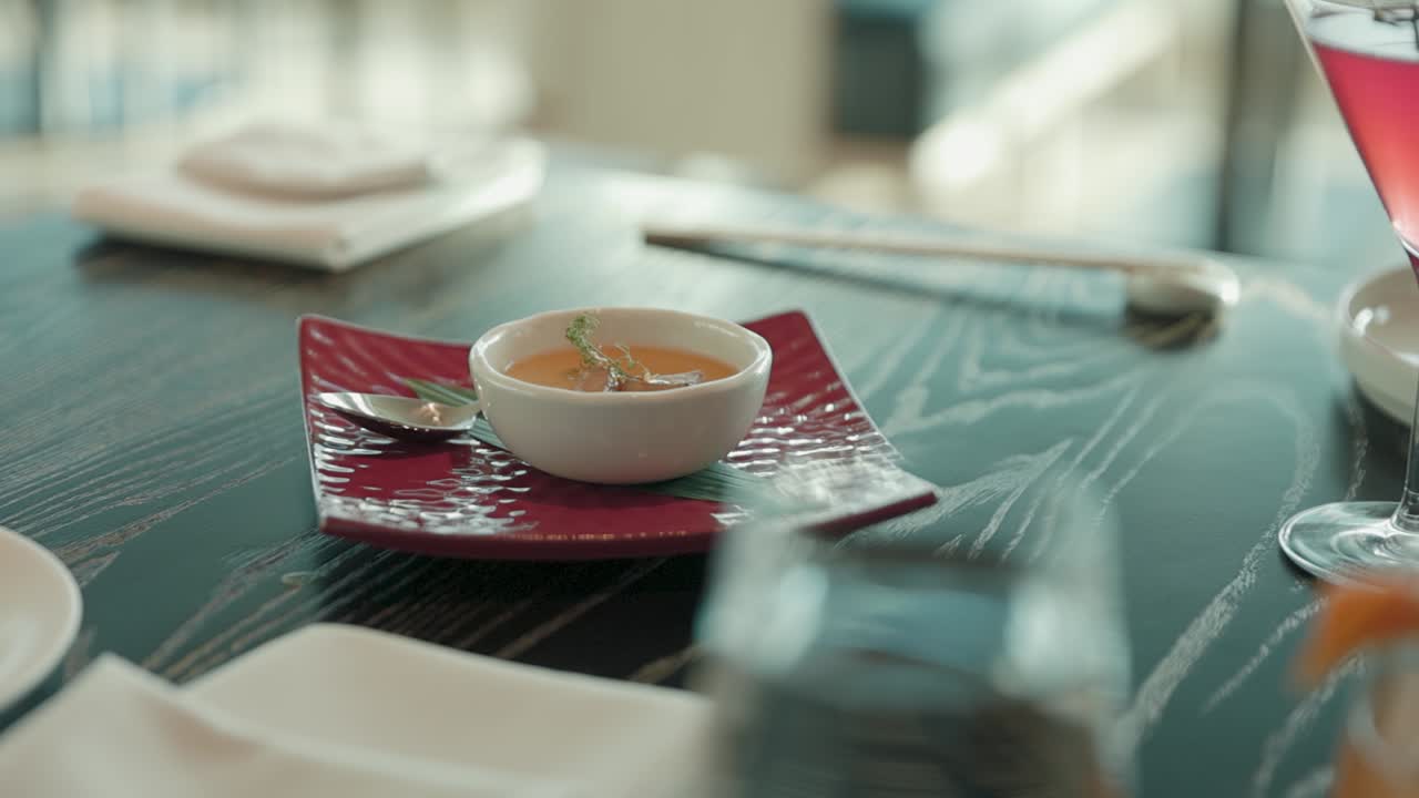 Delicious bisque appetizer served in a bowl on a restaurant table