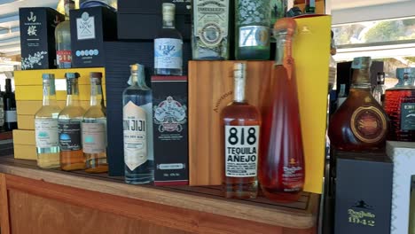 various spirits bottles arranged on a display shelf