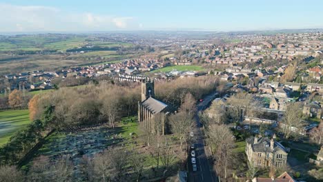 cinematic aerial view of saint john the evangelist church dewsbury moor uk