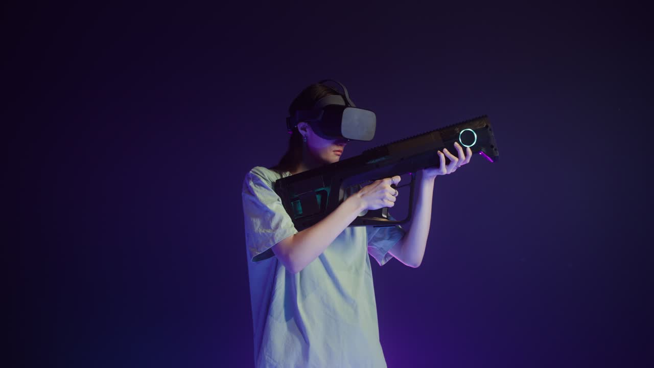 Woman playing VR game with gun
