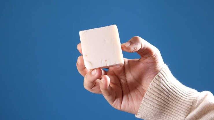 Hand holding a bar of soap