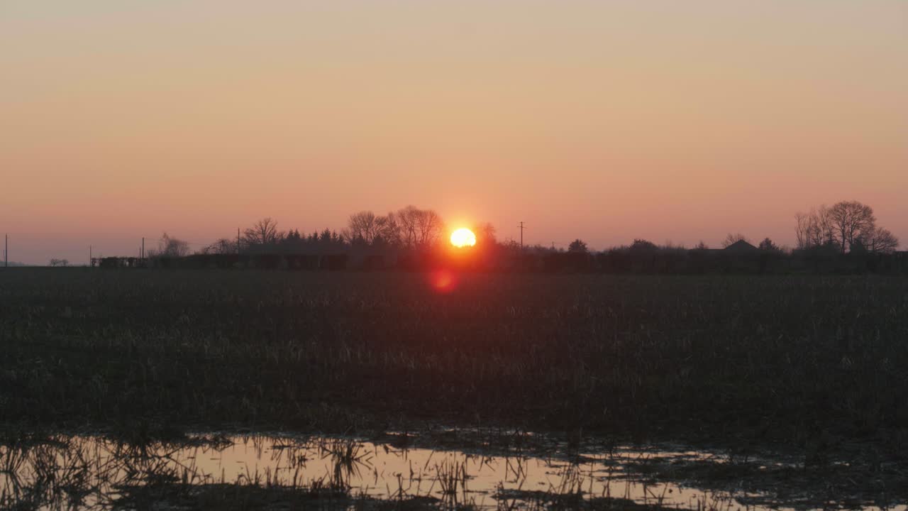 4K Cinematic landscape still shot of a field during sunset in the French countryside.