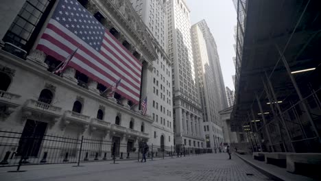 abandoned wall street stock exchange empty streets and girl statue of new york manhattan during the covid19 3