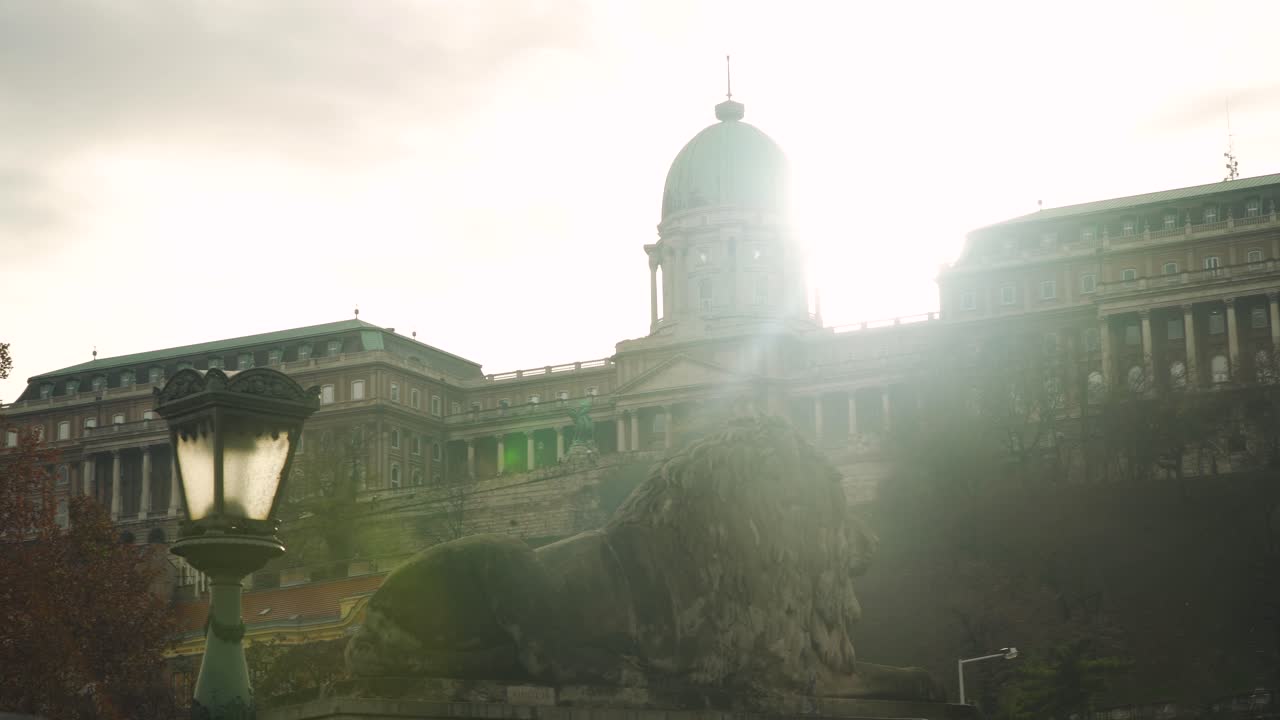 The sun setting behind the beautiful Hungarian Parliament Building in Budapest - right side pan