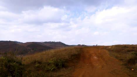 isolated-mountain-range-with-dramatic-sky-and-vacant-road-at-evening