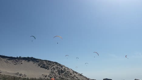 static view of parashoots floating in sky