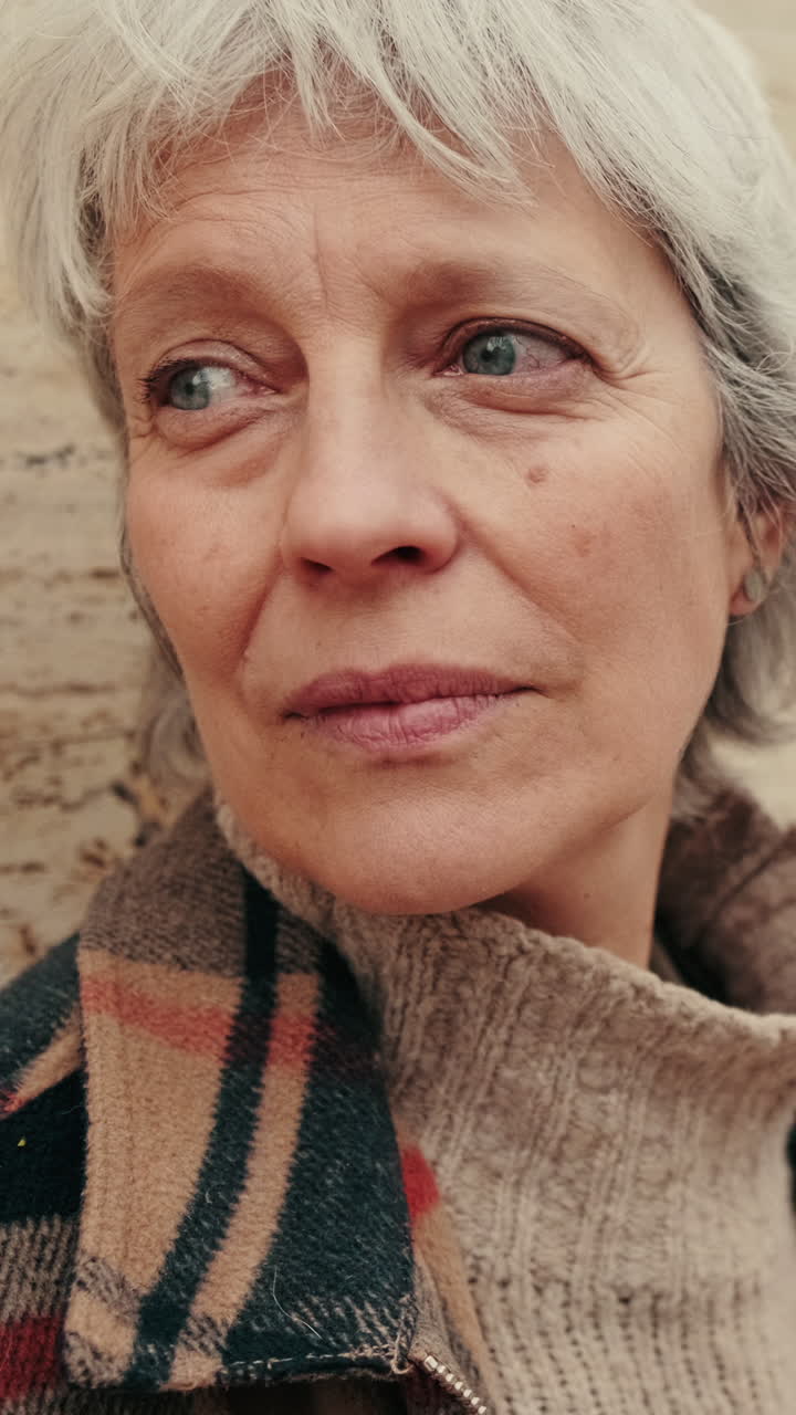 Close-up Portrait of a Pensive Senior Woman Looking Away
