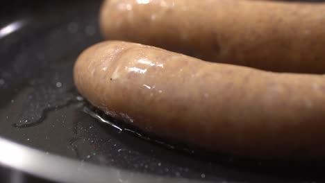 Closeup-shot-of-sauage-cooking-in-pan