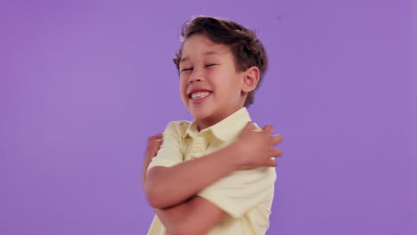 happy boy embracing himself
