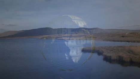 hundred?dollar bill globe floating over tranquil lake blending with gentle rolling hills background