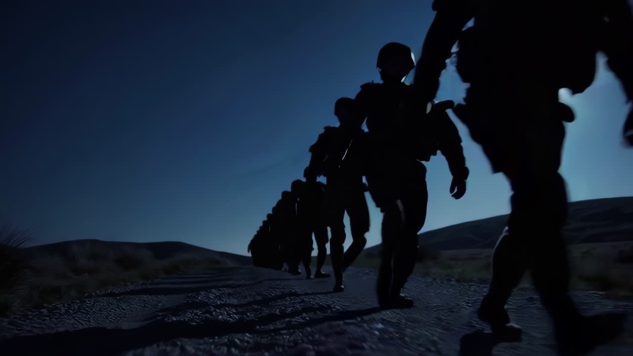 Silhouette of Military Personnel Marching at Night