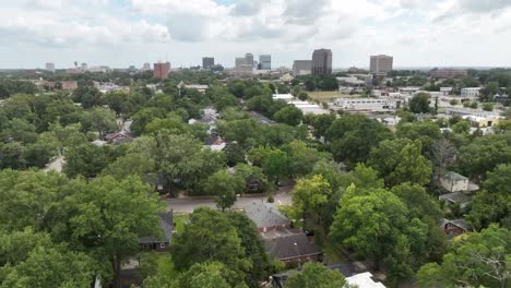 aerial view of a city with lush greenery and residential neighborhoods