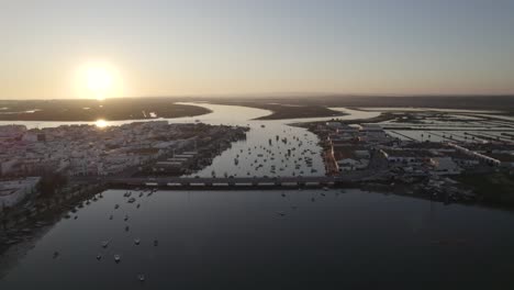 Sunset-Aerial-View-Of-Puente-Infanta-Cristina-And-Anchored-Boats,-Rio-Carreras