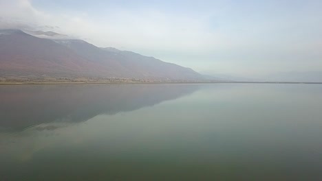 Drone-shot-over-a-lake-in-northern-Greece-during-golden-hour