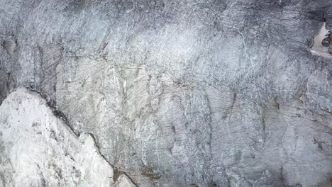 overhead drone view of an alpine glacier in summer at the swiss alps near grindelwald