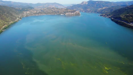 arial view of river danube with green algae and water pollution