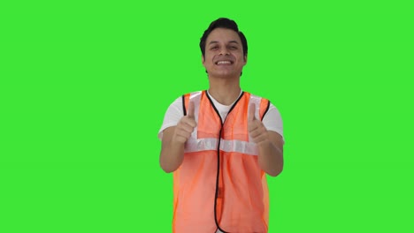 happy indian airport ground staff showing thumbs up green screen