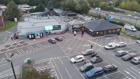 aerial orbital view of gordano services showing comprehensive layout with parking zones, amenity buildings and access roads, bristol, uk, october 2024