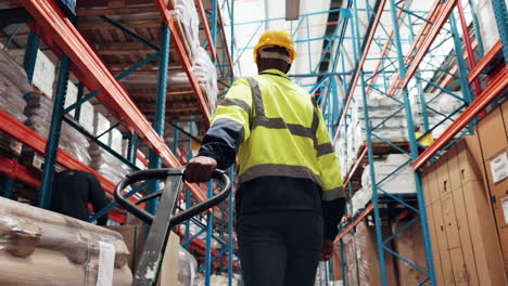 warehouse worker operating a pallet jack