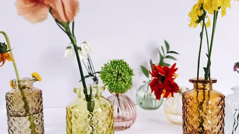 colorful flowers in small vases