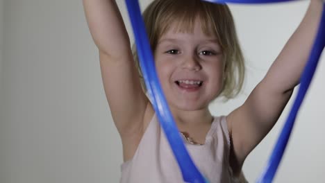 Child-having-fun-making-slime.-Kid-playing-with-hand-made-toy-slime.