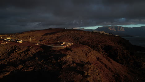 Fantastic-aerial-shot-in-orbit-and-at-a-distance-from-the-viewpoint-and-the-Sardina-lighthouse