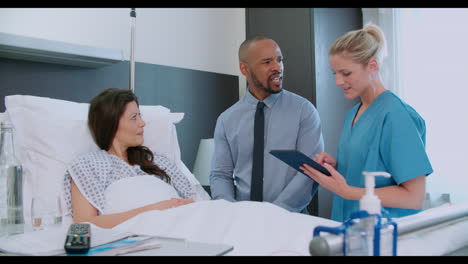 female patient and medical staff in consultation at hospital